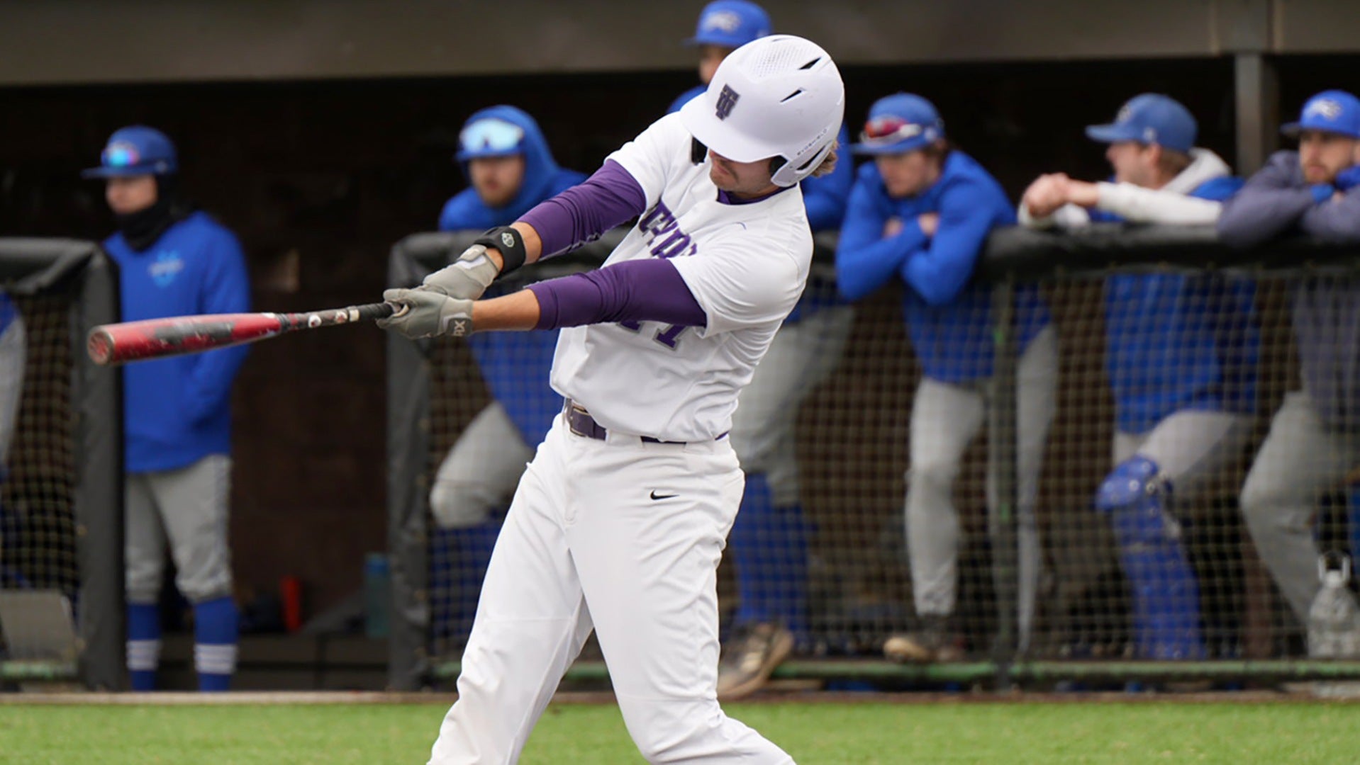 Male athlete swinging a baseball bat